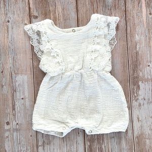 White lace baby romper.